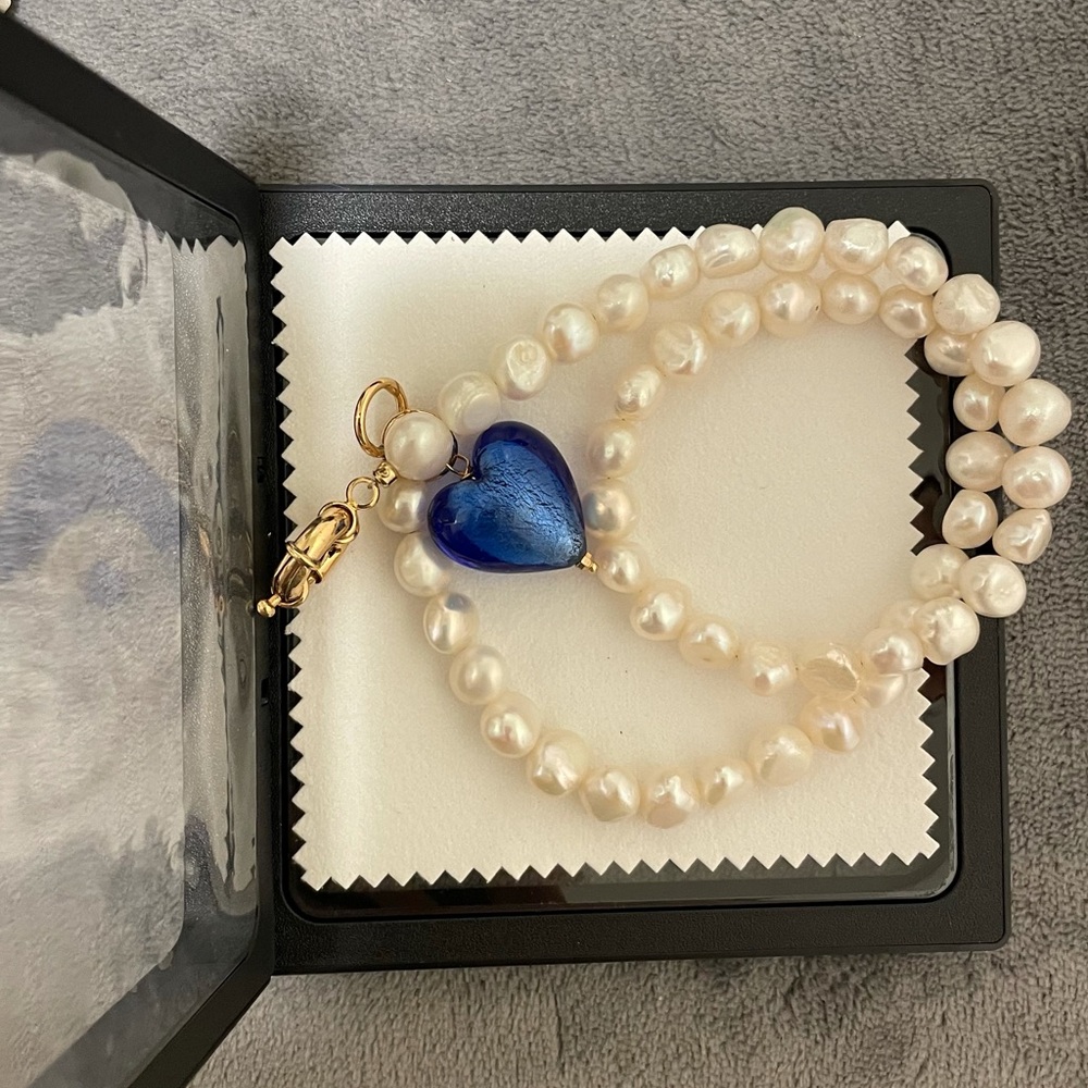 Natural pearls with blue glass heart